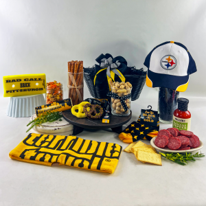 Steeler gift featuring the terrible towel, steeler hat,bad call brick and local snacks.