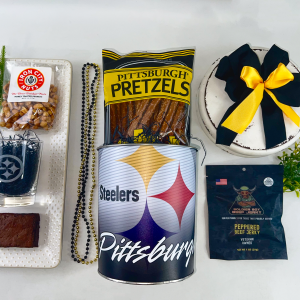 Pittsburgh Steelers themed gift featuring steeler merchandise - Etched glass with steelers logo, metal tin with lid, local snacks nuts, beef jerky and brownie