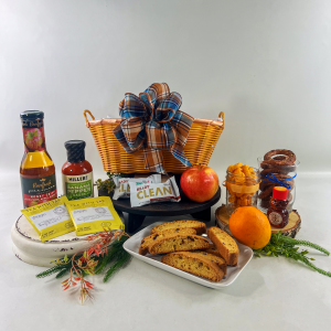 Gift Basket with apple juice, baked goods, tea and other snacks.