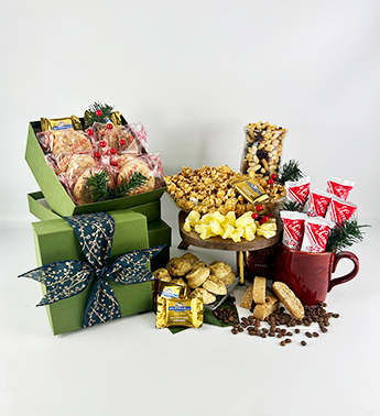 Photo of the olive tower gift with lots of cookies and snacks, finished with a pretty bow